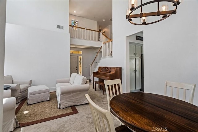28335 Arroyo Ct, Castaic, CA 91384 - dining room with a chandelier, a high ceiling, stairway, and recessed lighting