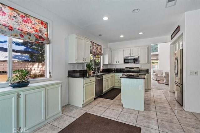 28335 Arroyo Ct, Castaic, CA 91384 - kitchen with stainless steel appliances, healthy amount of natural light, a kitchen island, recessed lighting, and dark countertops