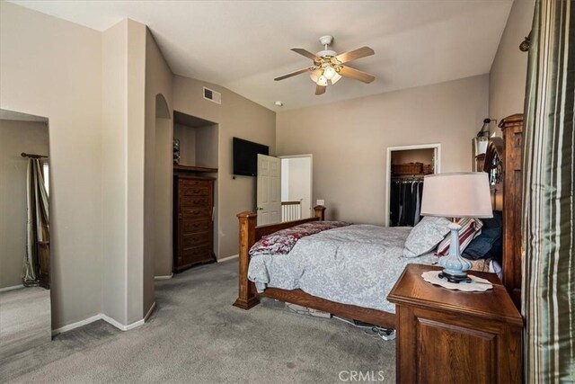 28335 Arroyo Ct, Castaic, CA 91384 - carpeted bedroom featuring baseboards, arched walkways, a spacious closet, vaulted ceiling, and a ceiling fan