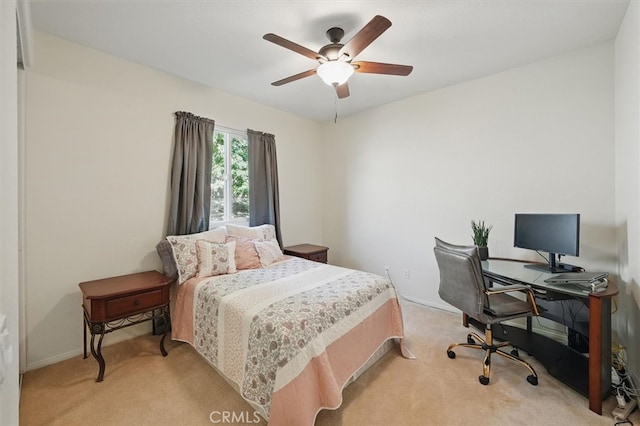 29661 Cambridge Ave, Castaic, CA 91384 - bedroom featuring light colored carpet, an office area, a ceiling fan, and baseboards