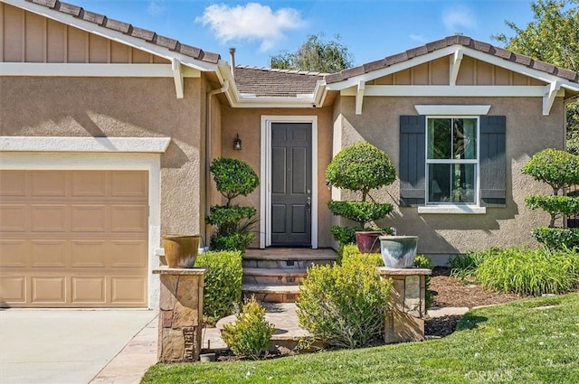 29661 Cambridge Ave, Castaic, CA 91384 - doorway to property with an attached garage, stucco siding, a tile roof, and driveway