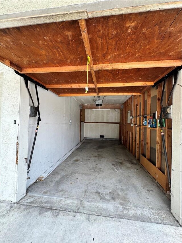 4591 Orange Ave Unit 306, Long Beach, CA 90807 - garage featuring a garage door opener