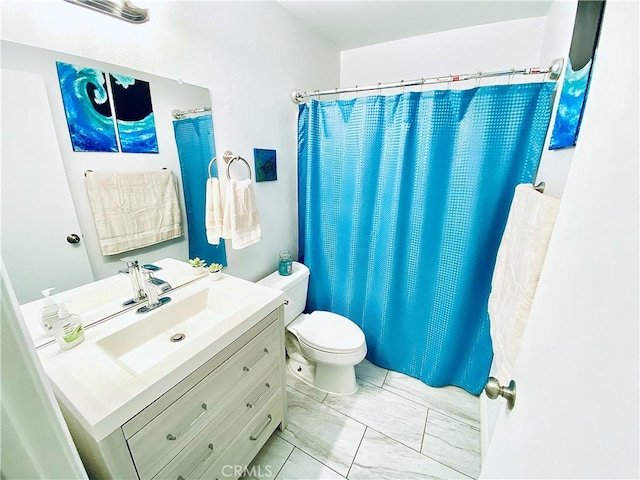 4591 Orange Ave Unit 306, Long Beach, CA 90807 - full bath featuring toilet, vanity, marble look tiles, and a shower with shower curtain