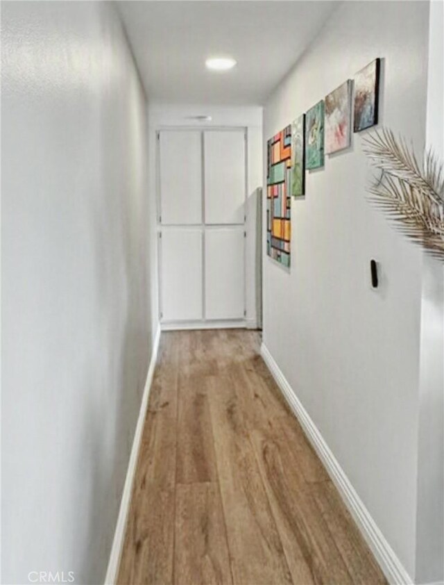 4591 Orange Ave Unit 306, Long Beach, CA 90807 - corridor with baseboards and wood finished floors
