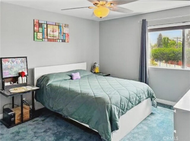 4591 Orange Ave Unit 306, Long Beach, CA 90807 - bedroom featuring baseboards, a ceiling fan, and carpet floors