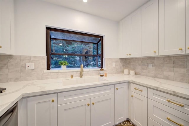 953 Sheffield St, Cambria, CA 93428 - kitchen with a sink, white cabinetry, backsplash, and light stone counters
