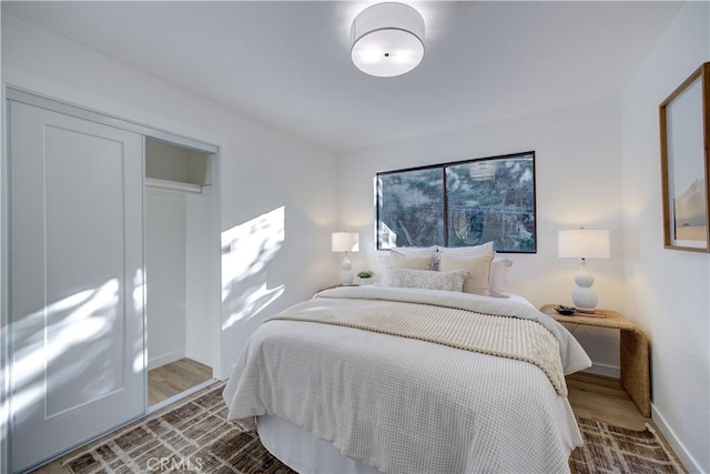 953 Sheffield St, Cambria, CA 93428 - bedroom featuring baseboards, a closet, and wood finished floors