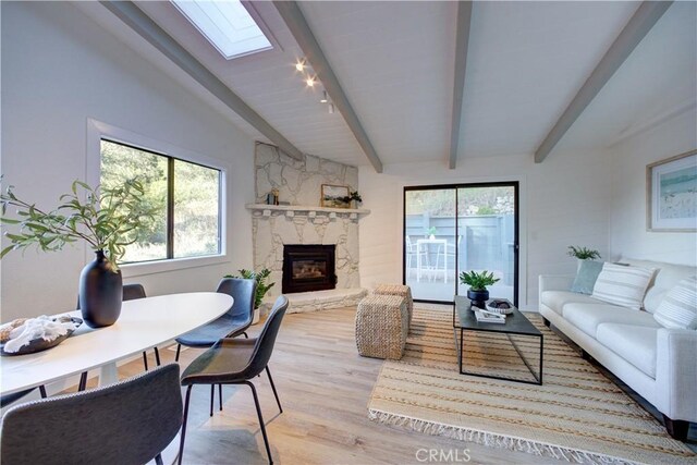953 Sheffield St, Cambria, CA 93428 - living area featuring a skylight, wood finished floors, a fireplace, and beamed ceiling