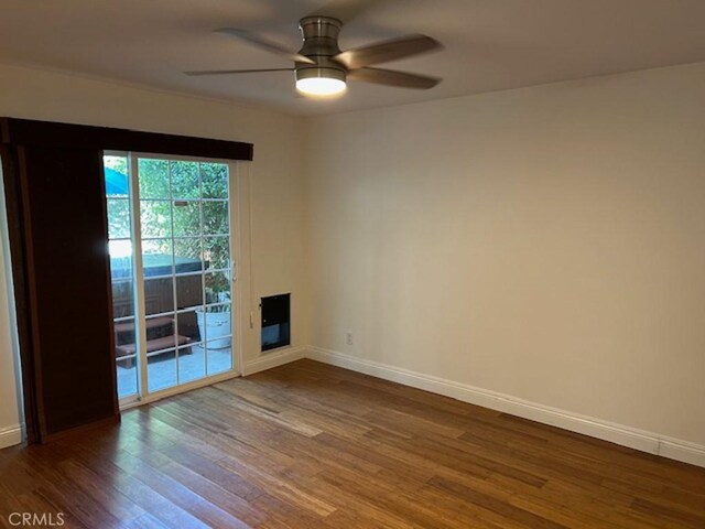 1541 Steinhart Ave, Redondo Beach, CA 90278 - spare room with wood finished floors, ceiling fan, and baseboards