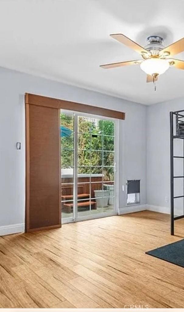 1541 Steinhart Ave, Redondo Beach, CA 90278 - unfurnished room with light wood finished floors, baseboards, and ceiling fan