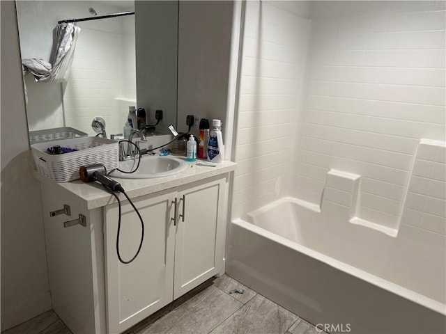 bathroom with shower / bathtub combination and vanity