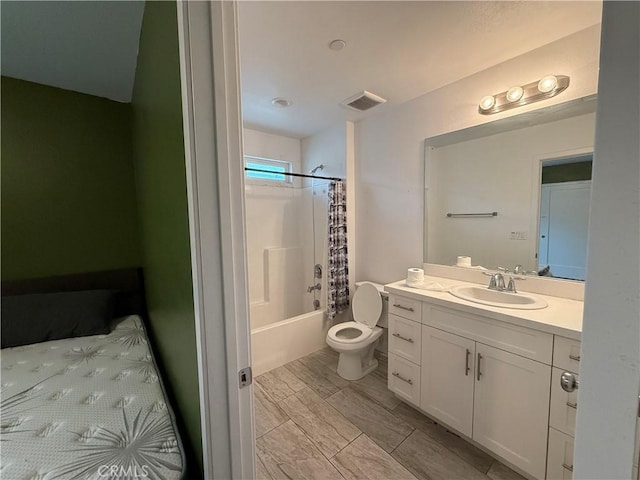 bathroom featuring vanity, toilet, and shower / bath combination with curtain