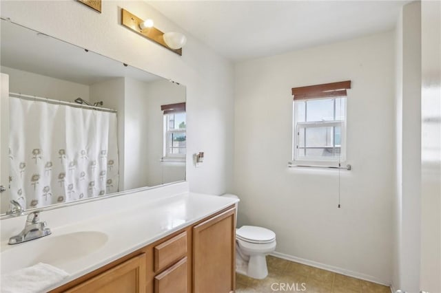 7055 Springtime Ave, Fontana, CA 92336 - full bathroom with vanity, toilet, healthy amount of natural light, and baseboards