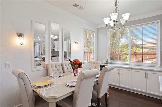 4885 Dandelion, Tracy, CA 95377 - dining room featuring ornamental molding, a chandelier, and dark wood-style floors