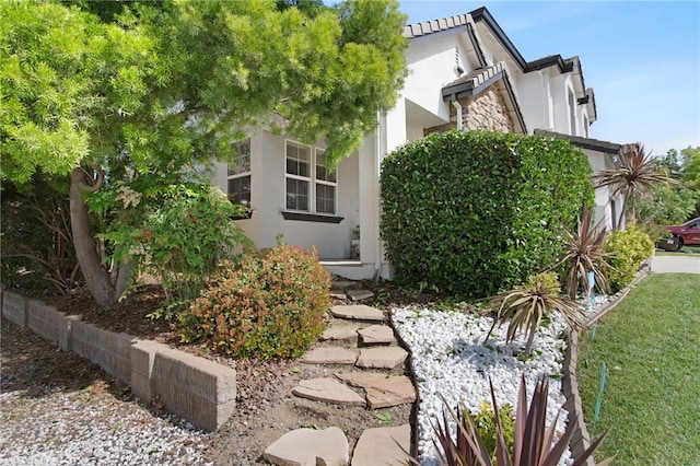 4885 Dandelion, Tracy, CA 95377 - view of property exterior featuring stucco siding and stone siding