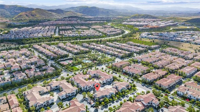 aerial overview of property's location featuring mountains and nearby suburban area
