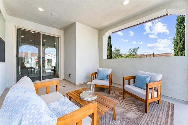 view of patio featuring an outdoor living space and a balcony