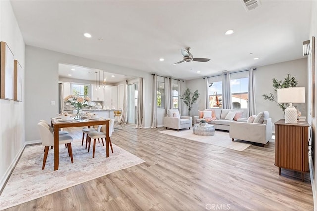 dining space featuring recessed lighting, light wood-style floors, ceiling fan, and baseboards
