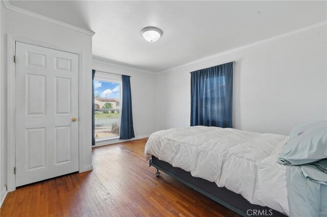 832 S 7th St, Alhambra, CA 91801 - bedroom with crown molding, hardwood / wood-style flooring, and baseboards