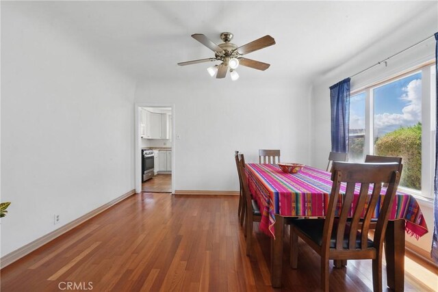 832 S 7th St, Alhambra, CA 91801 - dining room with wood finished floors, a ceiling fan, and baseboards