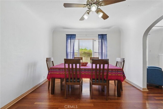 832 S 7th St, Alhambra, CA 91801 - dining space featuring arched walkways, wood finished floors, baseboards, and a ceiling fan