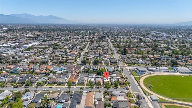 832 S 7th St, Alhambra, CA 91801 - aerial view of property and surrounding area featuring a mountainous background and nearby suburban area
