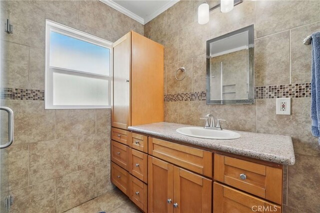 832 S 7th St, Alhambra, CA 91801 - bathroom featuring crown molding, a stall shower, vanity, tile walls, and tasteful backsplash