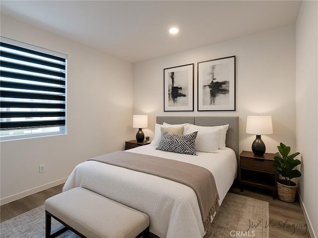 3661 S Allston Paseo Unit 7, Ontario, CA 91761 - bedroom featuring wood finished floors, baseboards, and recessed lighting