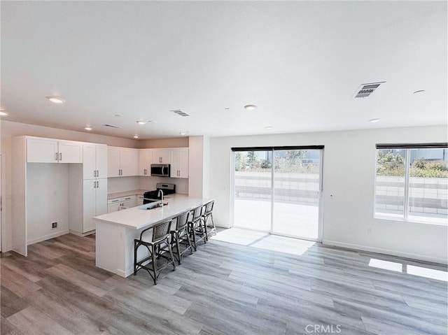 3661 S Allston Paseo Unit 7, Ontario, CA 91761 - kitchen featuring stainless steel appliances, a sink, healthy amount of natural light, light countertops, and recessed lighting