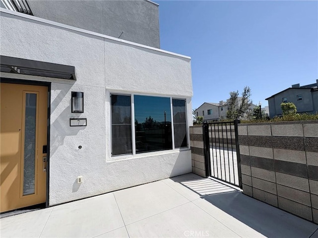 3661 S Allston Paseo Unit 7, Ontario, CA 91761 - view of patio / terrace with a gate and elevator