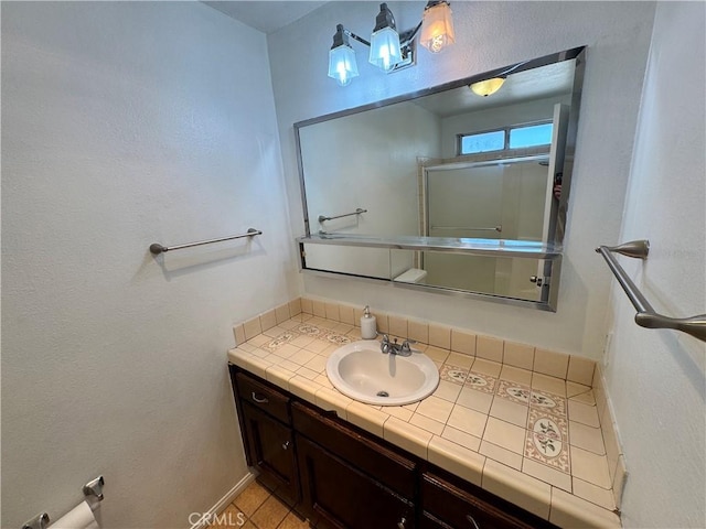8723 Palomar Ave, Yucca Valley, CA 92284 - bathroom with vanity and baseboards