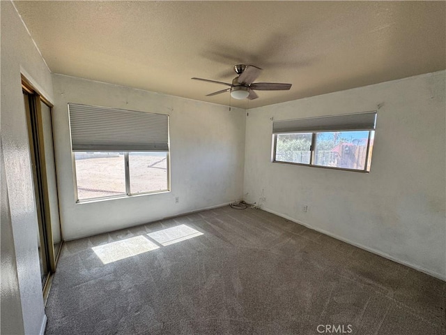 8723 Palomar Ave, Yucca Valley, CA 92284 - carpeted empty room with a ceiling fan