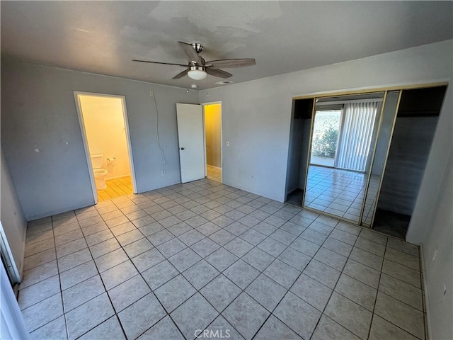 8723 Palomar Ave, Yucca Valley, CA 92284 - unfurnished bedroom featuring light tile patterned floors and a ceiling fan
