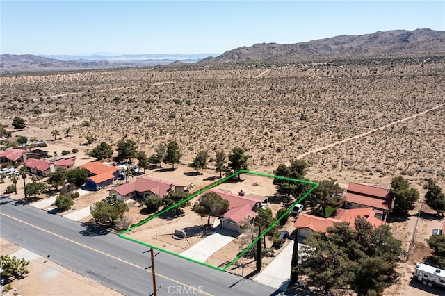 8723 Palomar Ave, Yucca Valley, CA 92284 - overview of rural landscape featuring a desert landscape, mountains, and property parcel outlined