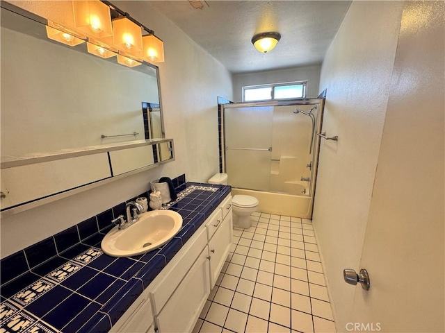 8723 Palomar Ave, Yucca Valley, CA 92284 - bathroom with tile patterned flooring, toilet, vanity, and tub / shower combination