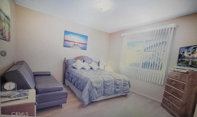 25813 Sandy Lodge Rd, Menifee, CA 92586 - bedroom with a textured ceiling and baseboards