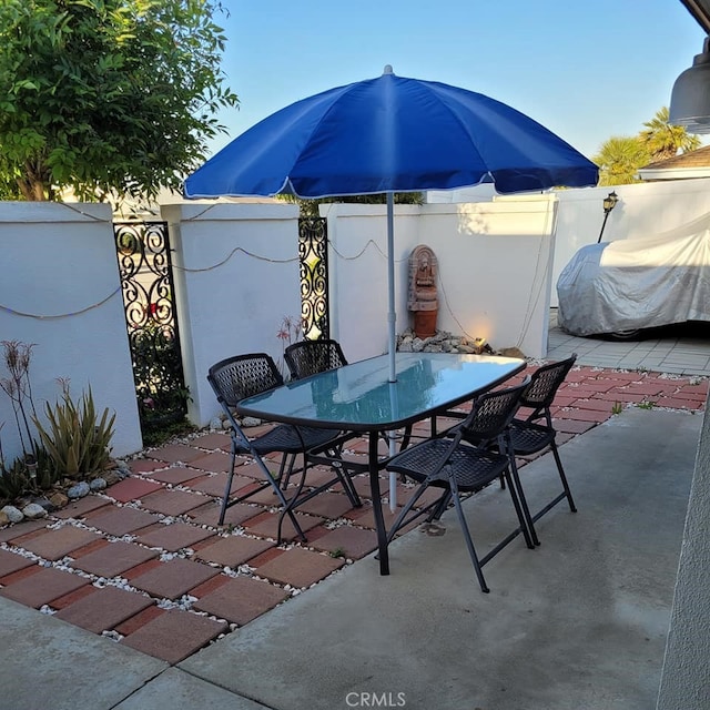 25813 Sandy Lodge Rd, Menifee, CA 92586 - view of patio featuring outdoor dining space and fence