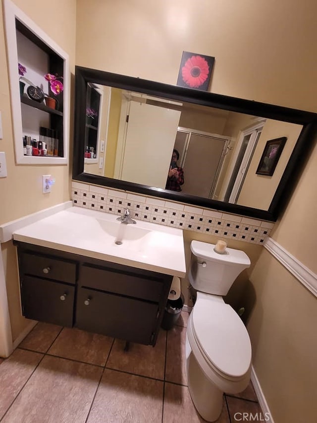 25813 Sandy Lodge Rd, Menifee, CA 92586 - bathroom with vanity, tile patterned flooring, toilet, and tasteful backsplash