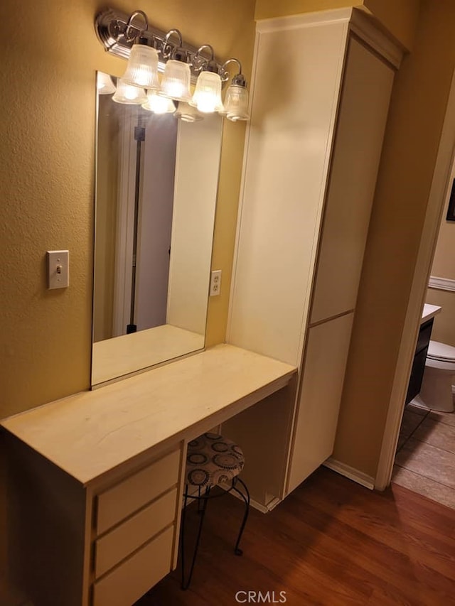 25813 Sandy Lodge Rd, Menifee, CA 92586 - bathroom with wood finished floors, toilet, and baseboards