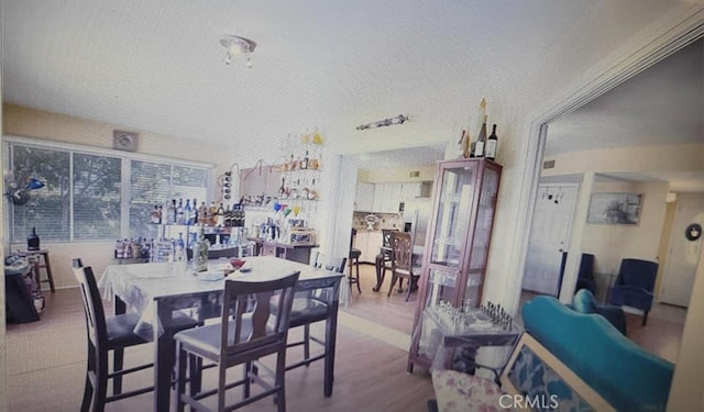 25813 Sandy Lodge Rd, Menifee, CA 92586 - dining area featuring a textured ceiling and wood finished floors
