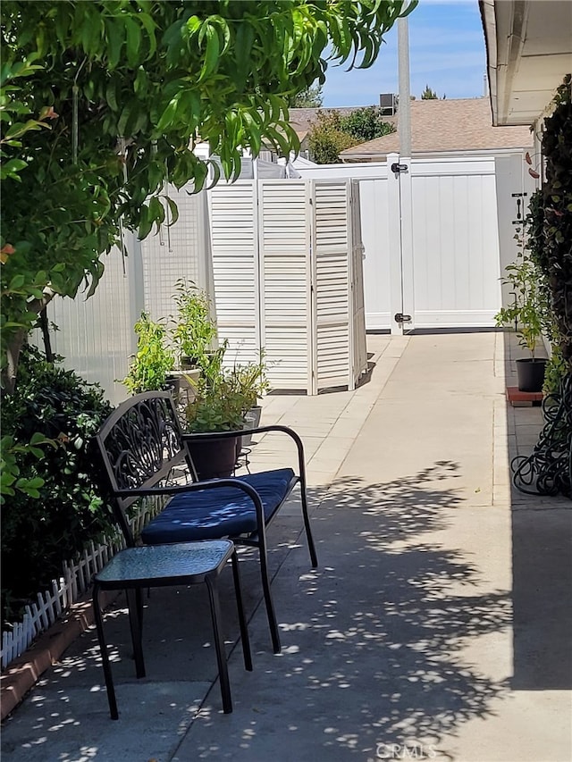 25813 Sandy Lodge Rd, Menifee, CA 92586 - view of patio / terrace featuring fence and a gate