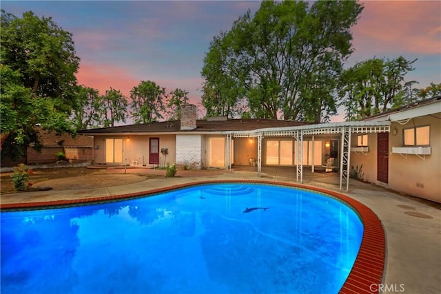 outdoor pool with a patio