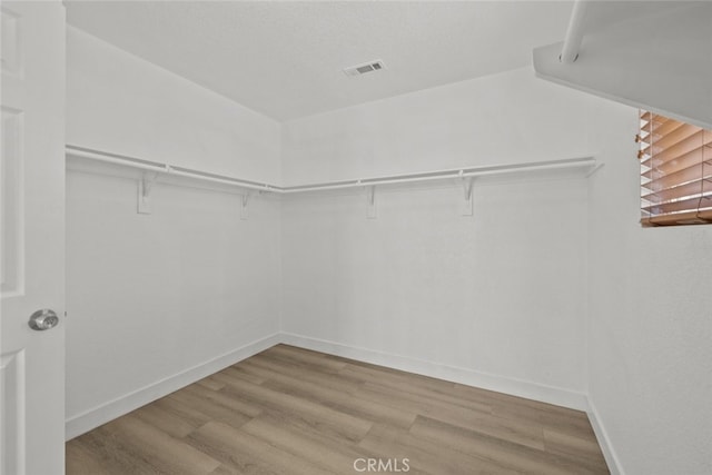 2455 Delicious Ln, Palmdale, CA 93551 - walk in closet with wood finished floors