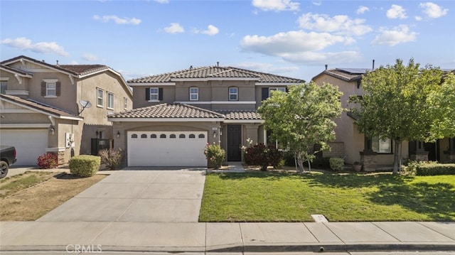 2455 Delicious Ln, Palmdale, CA 93551 - mediterranean / spanish home featuring stucco siding, a tile roof, a garage, concrete driveway, and a front lawn