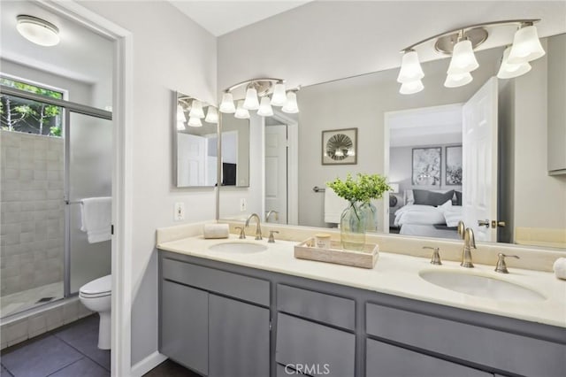 1304 12th St Unit B, Manhattan Beach, CA 90266 - ensuite bathroom with tile patterned flooring, a stall shower, double vanity, and toilet