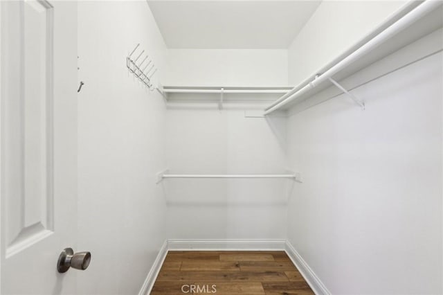 1304 12th St Unit B, Manhattan Beach, CA 90266 - walk in closet featuring wood finished floors