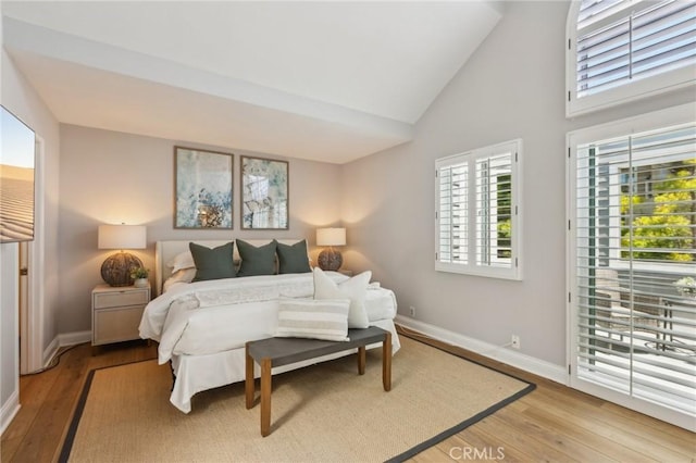 1304 12th St Unit B, Manhattan Beach, CA 90266 - bedroom with light wood-style flooring, baseboards, and high vaulted ceiling