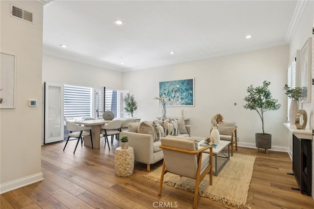 1304 12th St Unit B, Manhattan Beach, CA 90266 - living room featuring crown molding, hardwood / wood-style flooring, baseboards, and recessed lighting