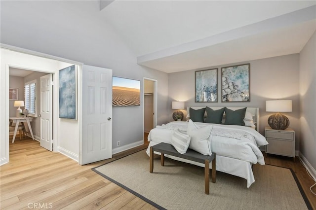 1304 12th St Unit B, Manhattan Beach, CA 90266 - bedroom with light wood-type flooring, baseboards, and lofted ceiling