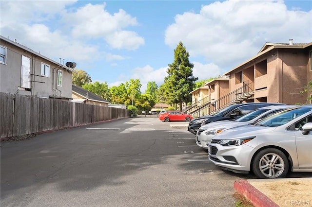 1114 Nord Ave Unit 11, Chico, CA 95926 - uncovered parking lot with fence and a residential view